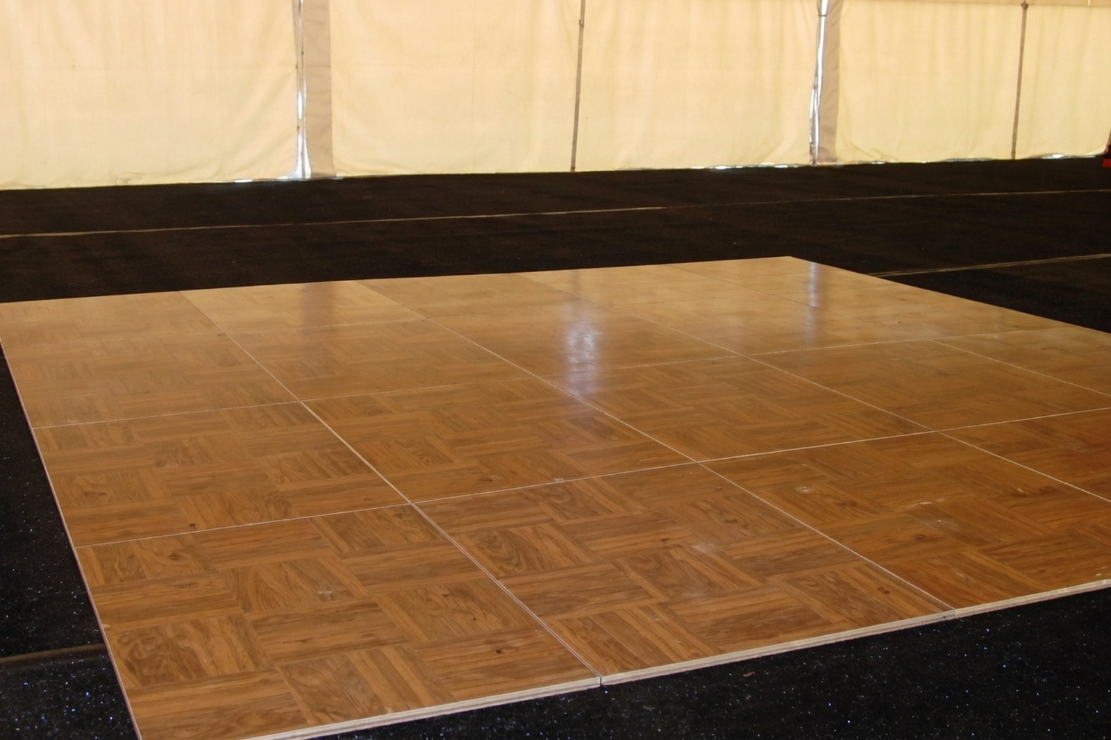 Parquet snap-lock dance floor inside an event tent